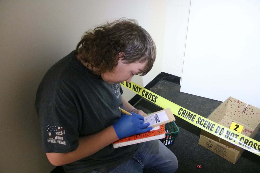 Jesse Bell investigates "crime scene"