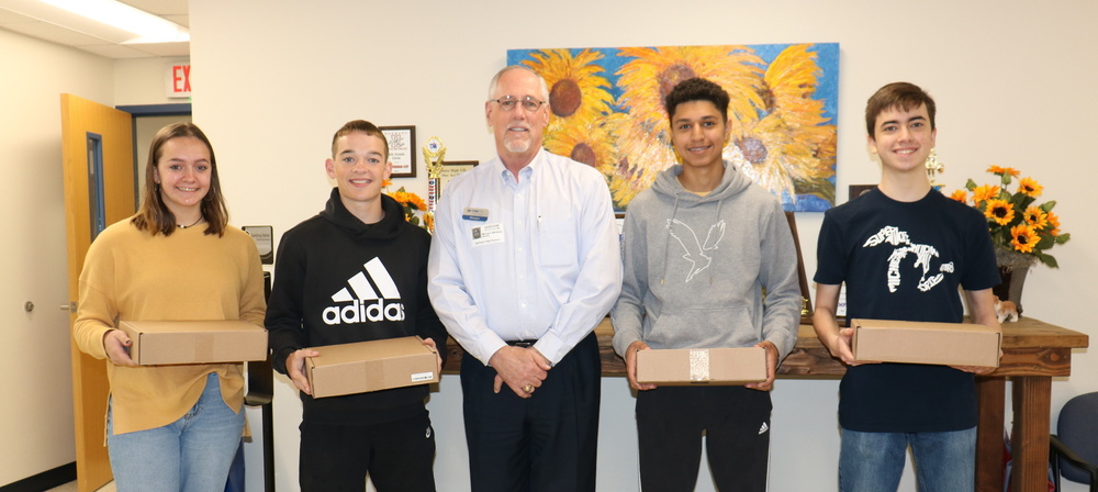 First National Bank of East Texas presents Chromebooks to QHS Students